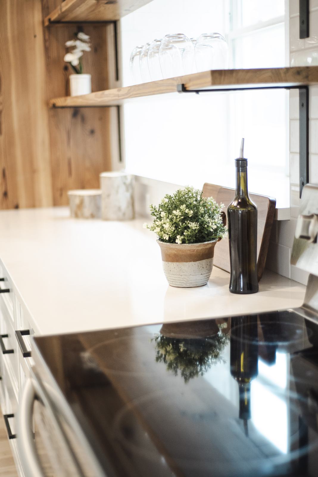 Bright kitchen counter with open wood shelves